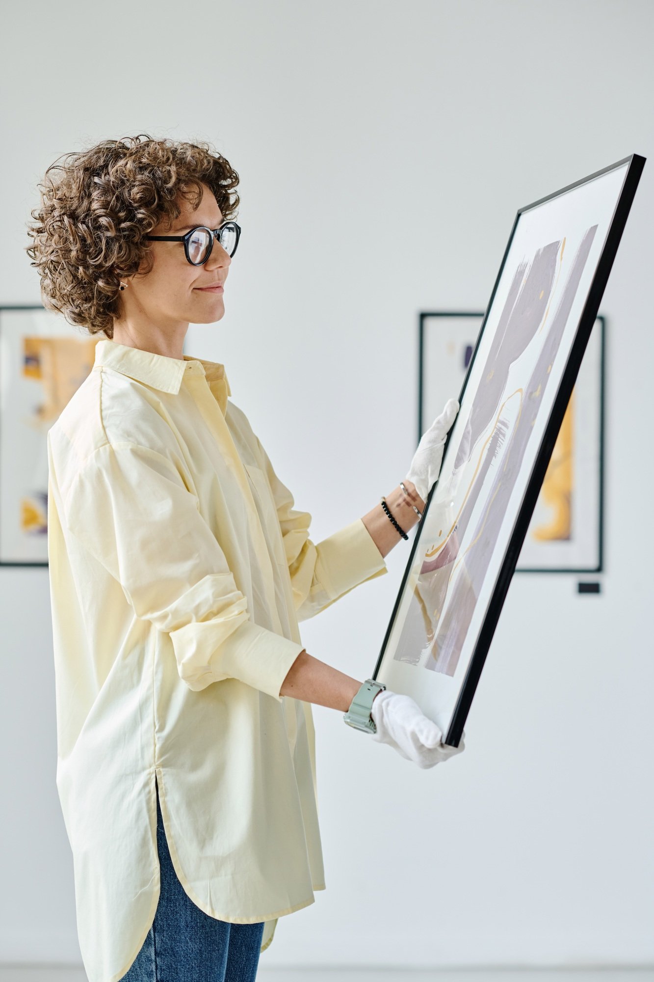 Gallery worker working with modern art